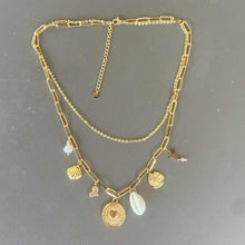 collier breloques coquillage