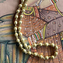 collier ras de cou boules doré