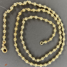 collier ras de cou boules doré