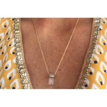 Collier doré avec cristal de roche