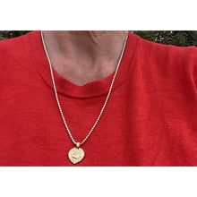 collier doré avec talisman au choix